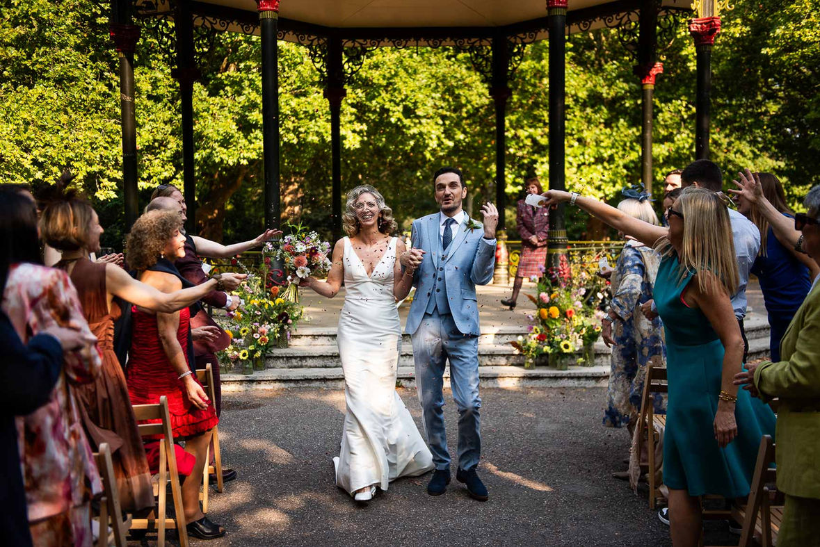 Happy couple exiting Battersea Park wedding ceremony