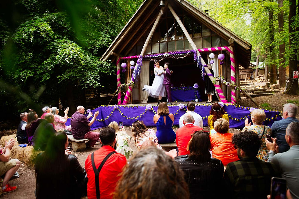 Editoriasl outdoor wedding ceremony at Wilderness Wood timber pavilion theater stage in East Sussex by Craig Preston Roberts