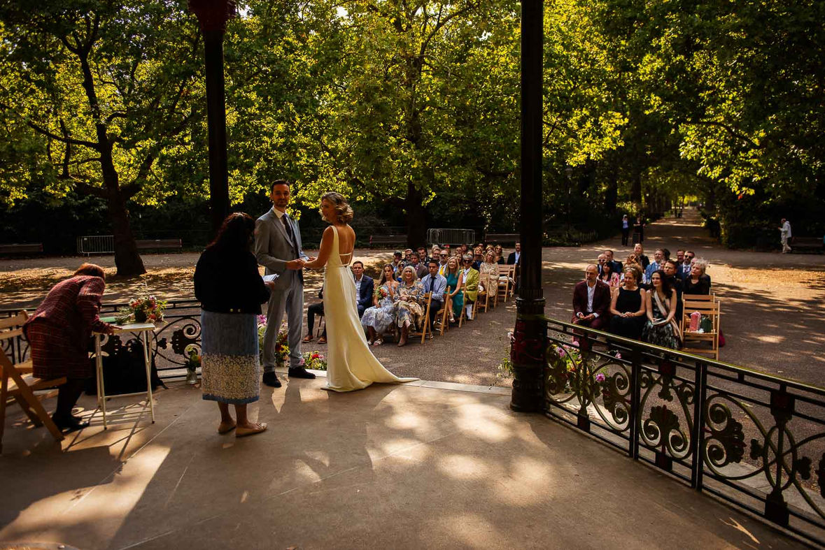 Couple exchanging vows at Battersea Park wedding ceremony