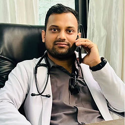 A male doctor holding a phone