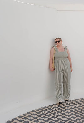 Model posing against a white wall