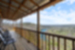 Chairs on a private deck overlooking the White River and Inspiration Valley at Can U Canoe in Eureka Springs