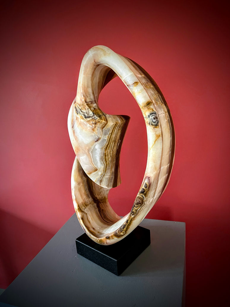 Image of blue onyx biomorphic stone sculpture named, Mercury's Retrograde by sculptor Greg Spitzer