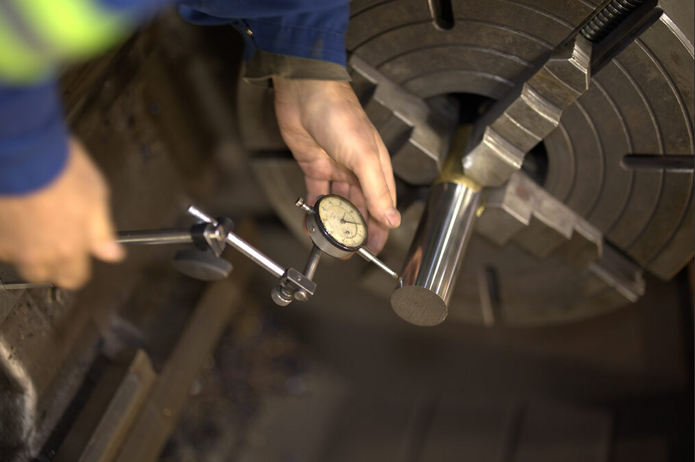 Person working on a hydraulic cylinder