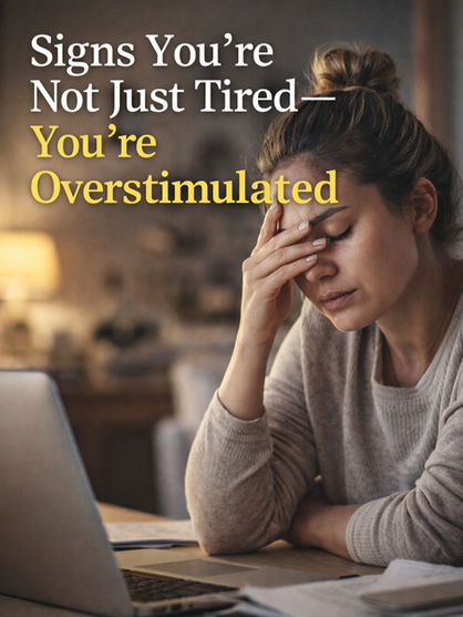 A woman sitting in front of her computer with her head in her hands. Eyes closed from exhaustion.