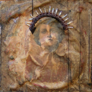 A  woman with a crown of spikes.  Piece made of recycled materials.