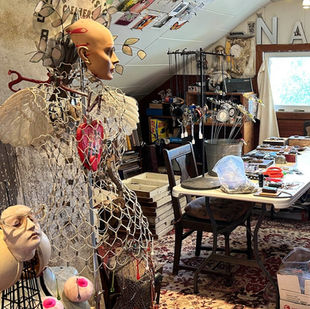 Victoria Hammond's studio filled with manikins, lace, netting, and all sorts of metal, clay, paper, and all sorts of interesting other found objects.
