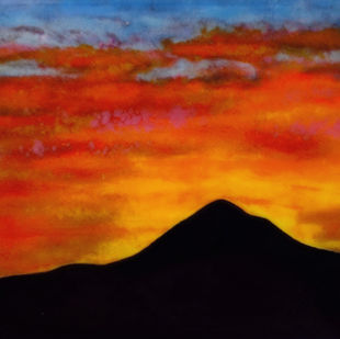 Greta Schneider fused glass art piece sunset behind mountain
