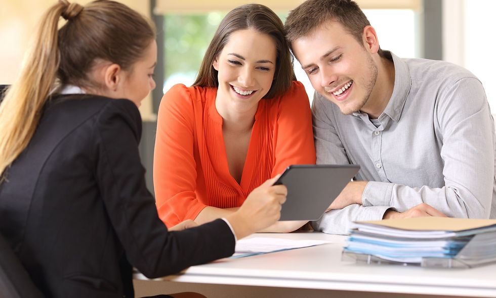 Seller showing on line products with a tablet to the customers in a desktop at office_edit