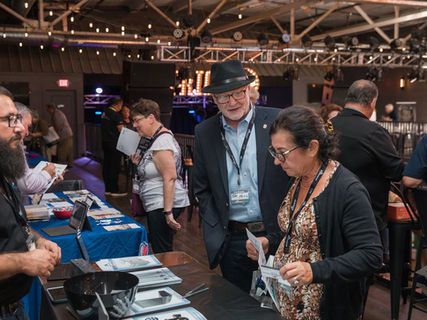 Attendees visiting sponsor exhibits and networking at KS HOA and Condo Association Expo.