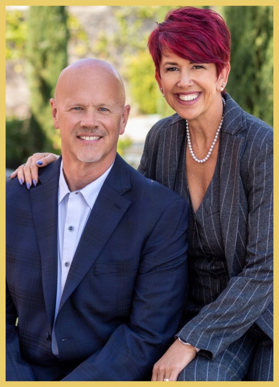 Smiling professional man and woman posing outdoors