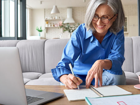 older woman happily working at home