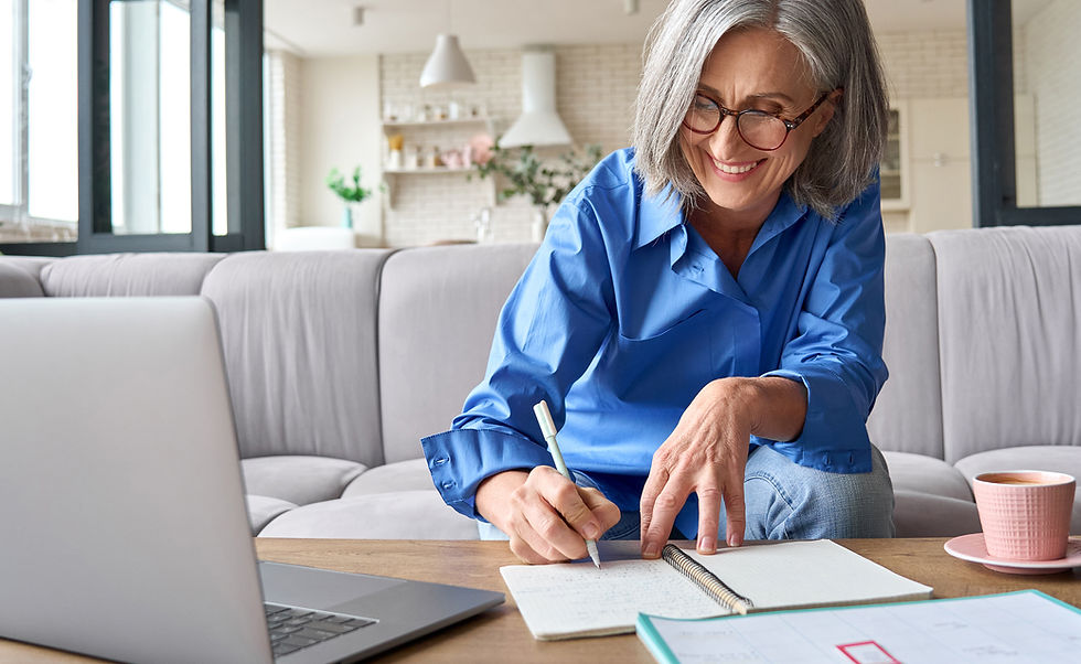 older woman happily working at home