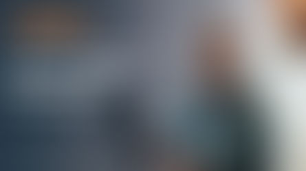 man and woman working together on laptop