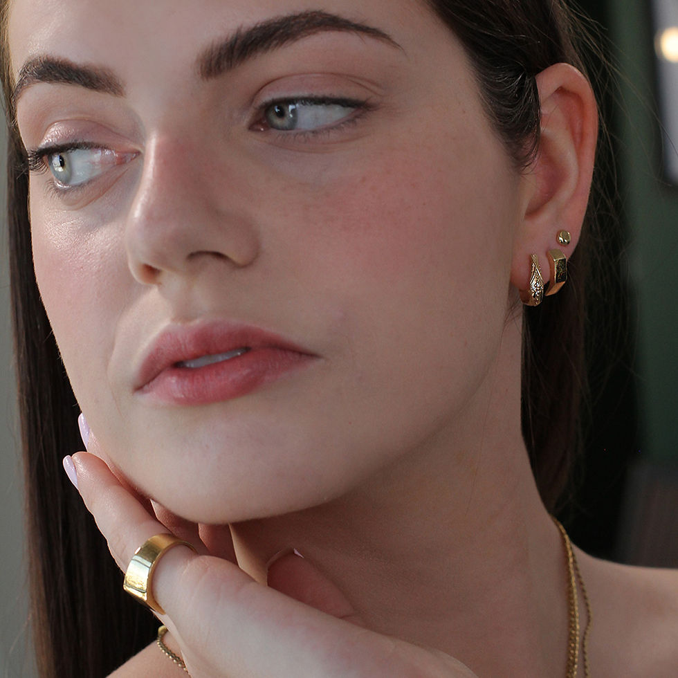 תמונה ממוזערת: A woman wearing the NINA - Handmade Signet Earrings in 14K gold, exuding elegance and sophistication with their timeless desi