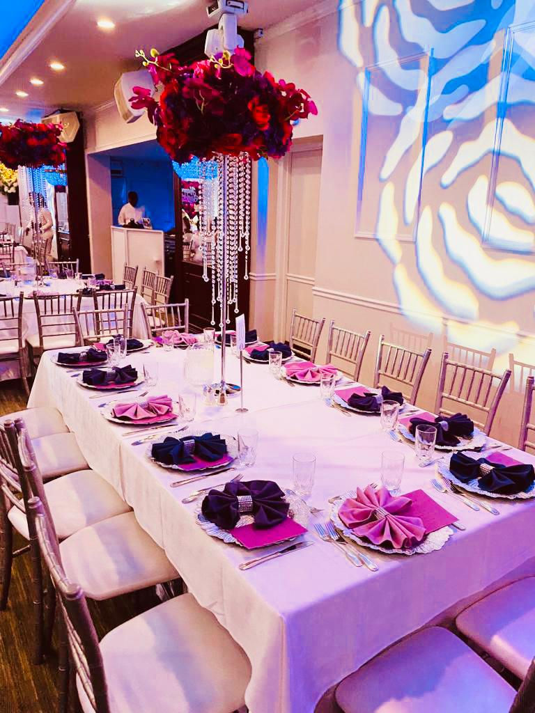 a long table with plates and napkins on it