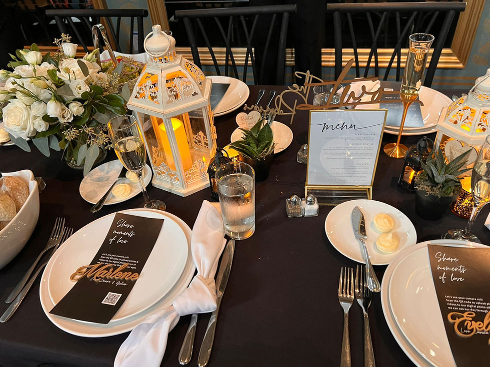 a table set for a wedding reception with a menu on it