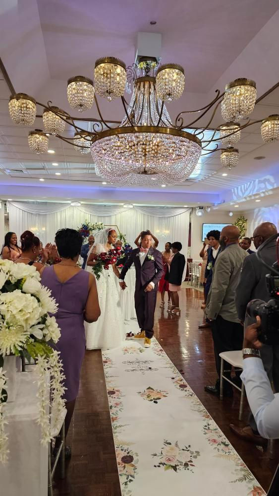 a bride and groom are walking down the aisle at their wedding
