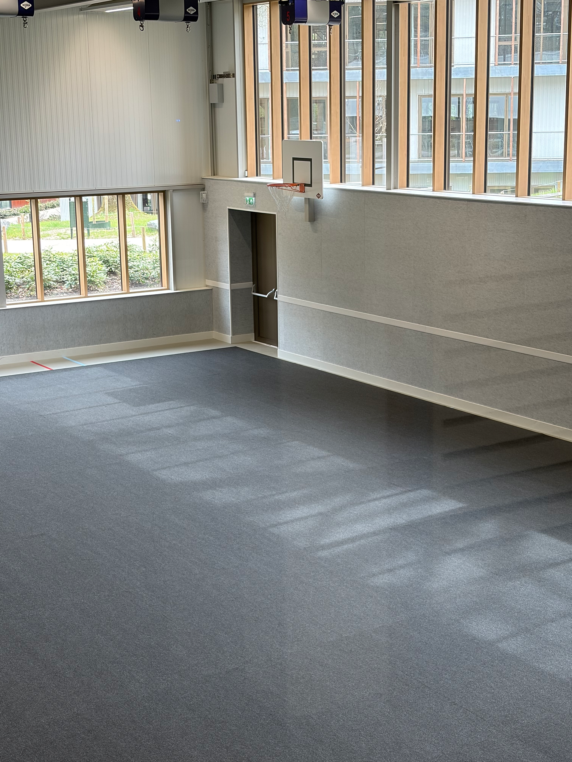 Aanzicht van de gymzaal met sportvloerbescherming