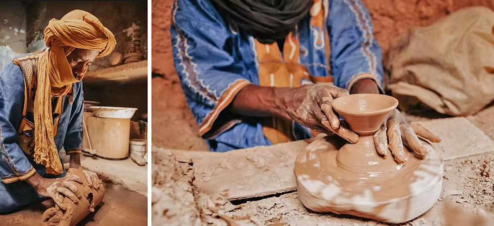 Tuareg in a blue robe and yellow headscarf kneads clay; close-up of hands shaping Tamegroute pottery. Warm, earthy setting, focused and skilled.
