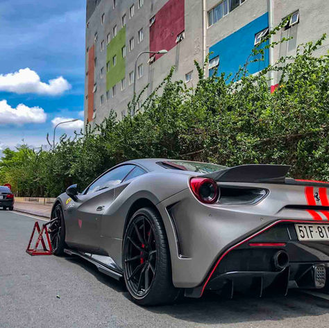 Ferrari Pista with red racing stripes and magnesium wheels by Litespeed Racing
