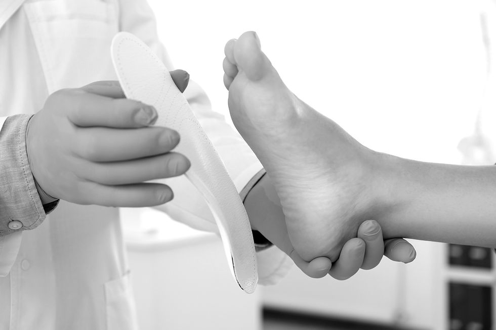 Chiropractor providing foot and ankle treatment at Invicta Performance clinic in Edmonton to improve mobility and relieve pai