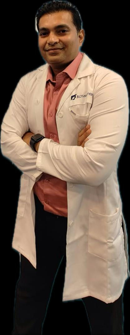 A close-up of a doctor in a white coat with folded arms.