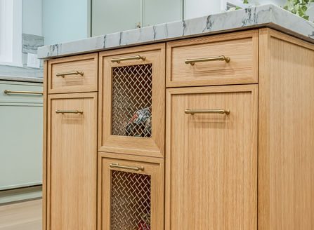 drawer with wire mesh insert inset for dry vegetable storage.