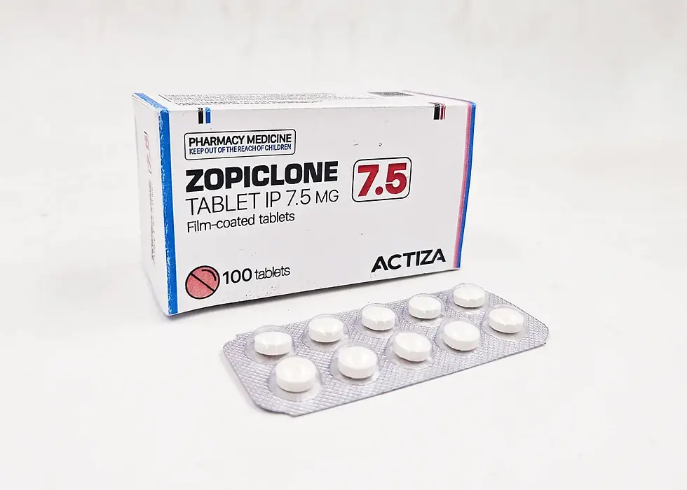 Zopiclone 7.5 mg tablets in blister pack, next to white and blue box labeled "PHARMACY MEDICINE" and "ACTIZA", on a white surface.