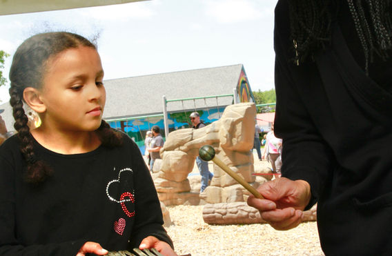 Ms. Matlock and a student at the instrument petting zoo.jpeg