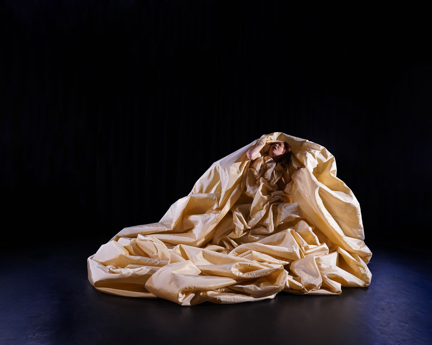 Costume-led reinterpretation of the Witch from Hansel and Gretel, expanding into a mountain-like form during performance
