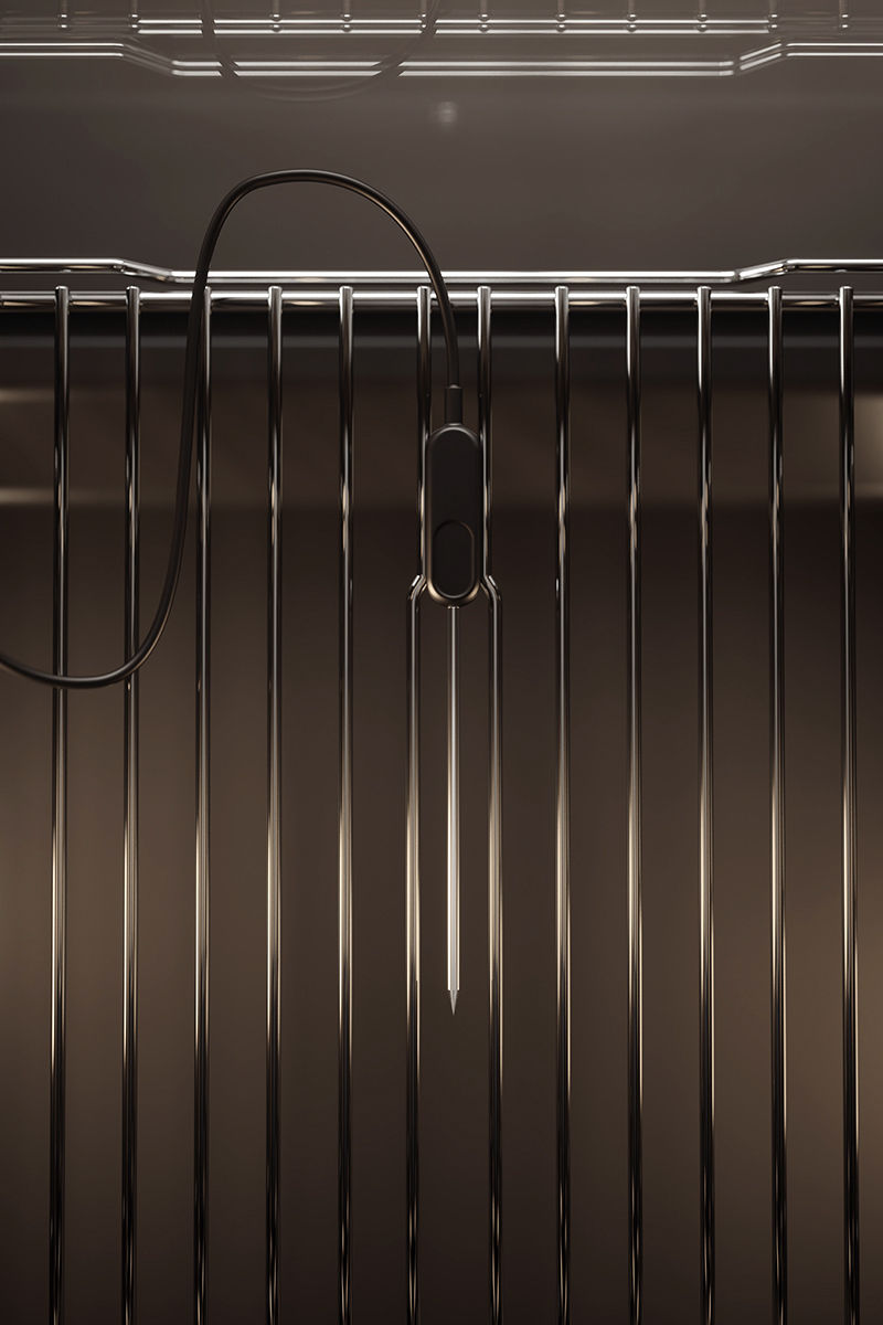Food probe hanging from a rack inside an ASKO oven