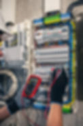 man-electrical-technician-working-switchboard-with-fuses (1).jpg