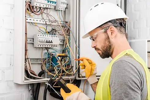 depositphotos_217090392-stock-photo-handsome-electrician-checking-electrical-box.jpg