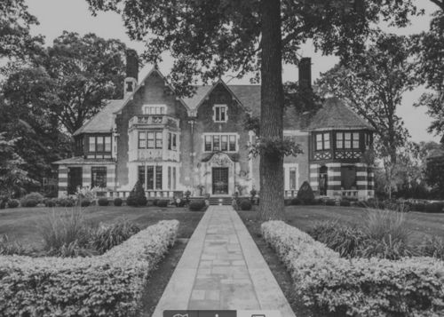 Eye-level view of the grand entrance of The Ivory Coach venue in the Boston Edison District