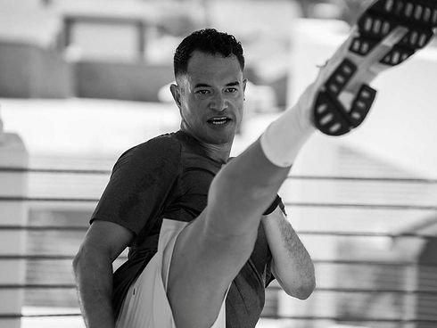 Peter Lopez, Owner Premier Martial Arts now Top Stars Martial arts kicking in the air.