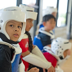 sparring students sit in class waiting turn