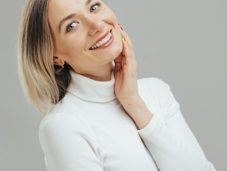 Woman smiling naturally during a Botox consultation at Ilume Aesthetics in Stoughton, Wisconsin