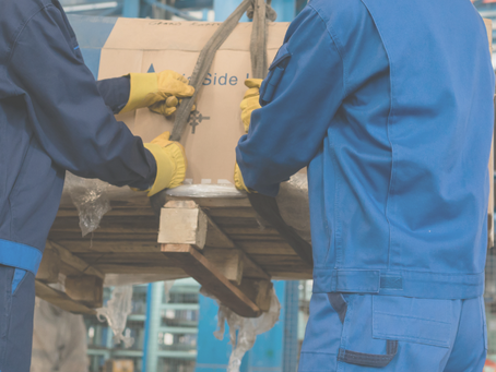 two workers using a manual handling sling