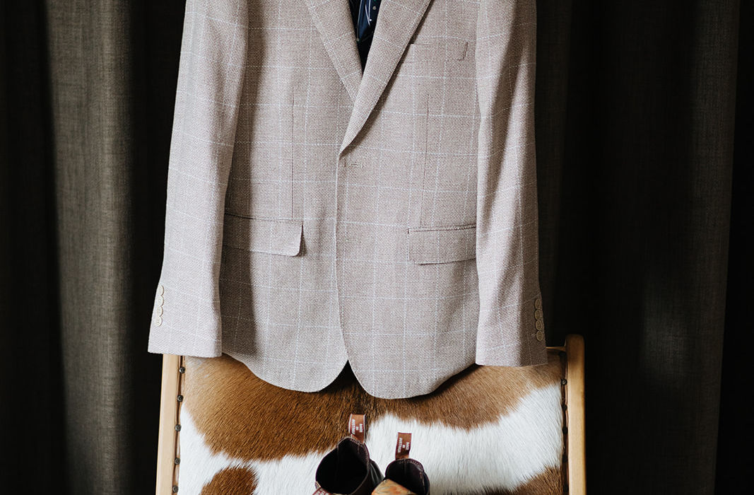 Groom’s suit and shoes set out in the suite at KVBR.