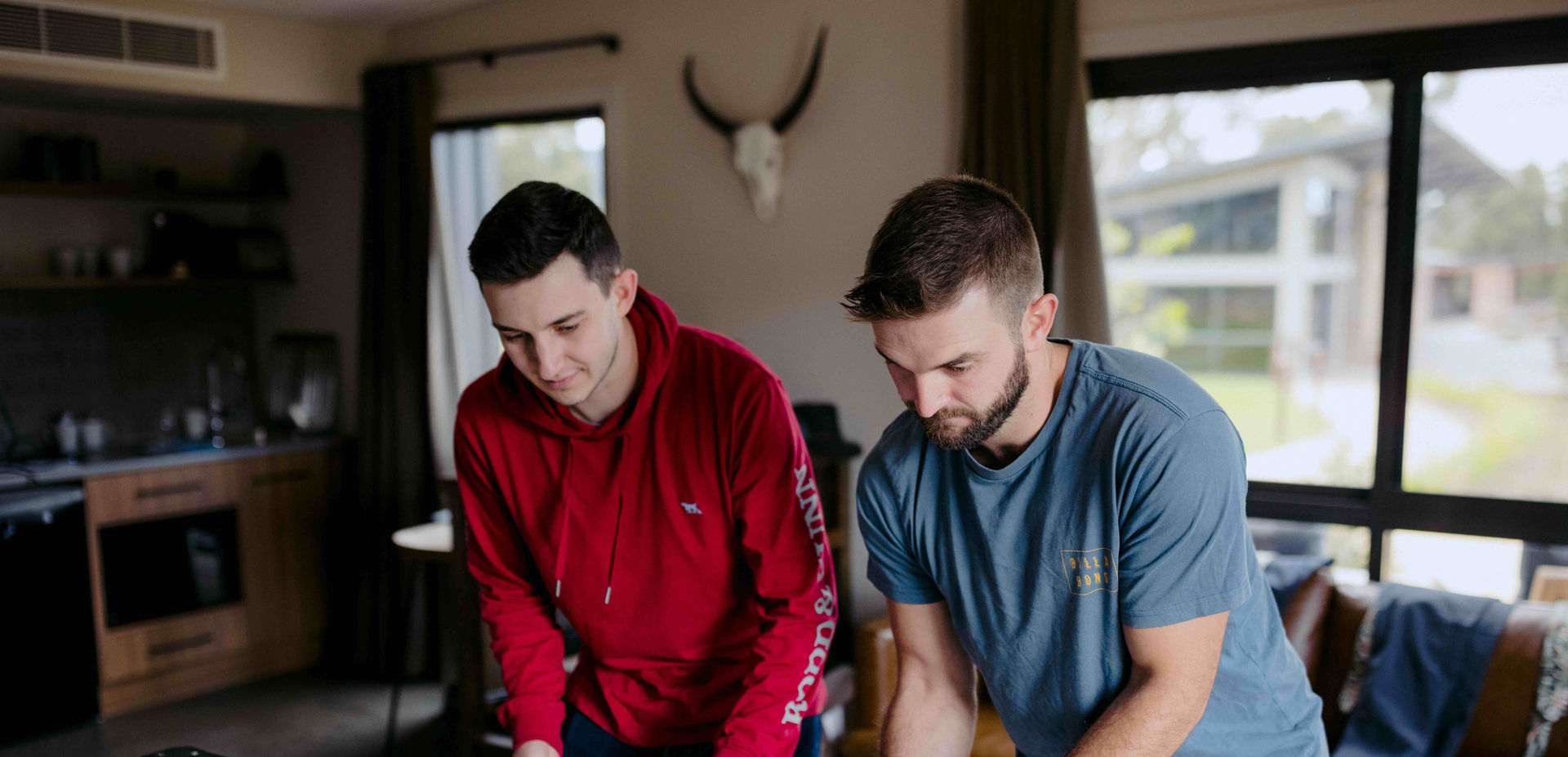 Groomsmen playing foosball together at KVBR.