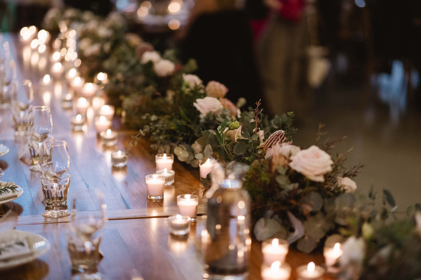 Close-up of candlelit wedding table decor at Kangaroo Valley Bush Retreat.