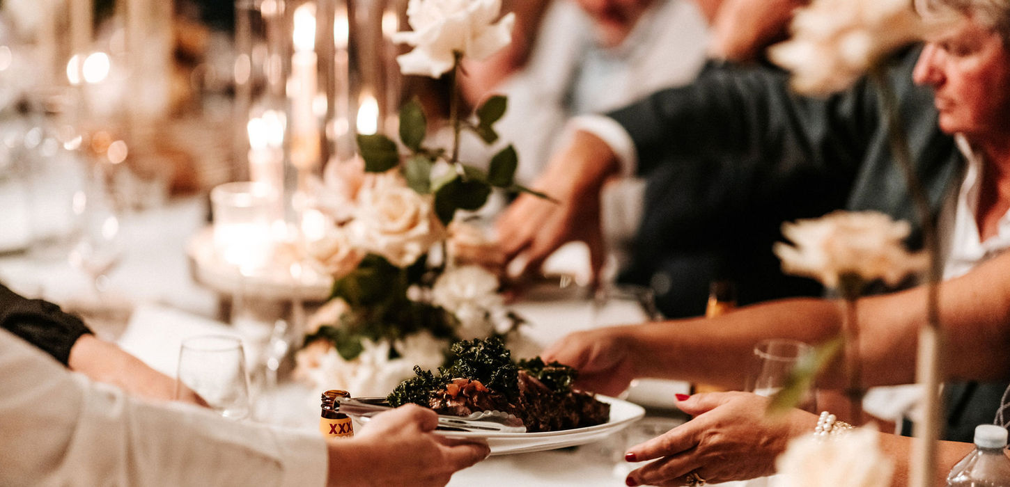 Guests sharing food family-style at Kangaroo Valley Bush Retreat reception.