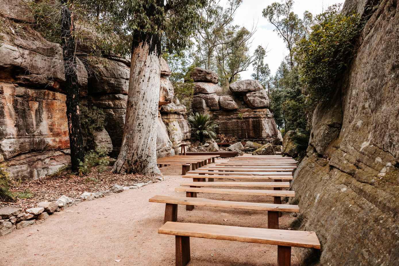Wooden benches set for ceremony in the Rock Cathedral at KVBR.
