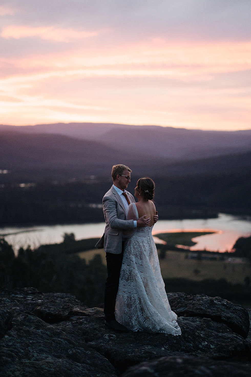 Newlyweds embrace for a portrait photo overlooking Kangaroo Valley