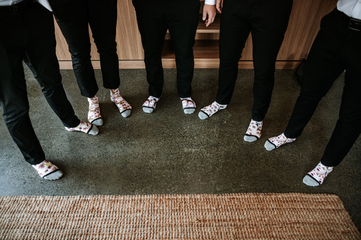 Groomsmen showing off matching socks at KVBR.