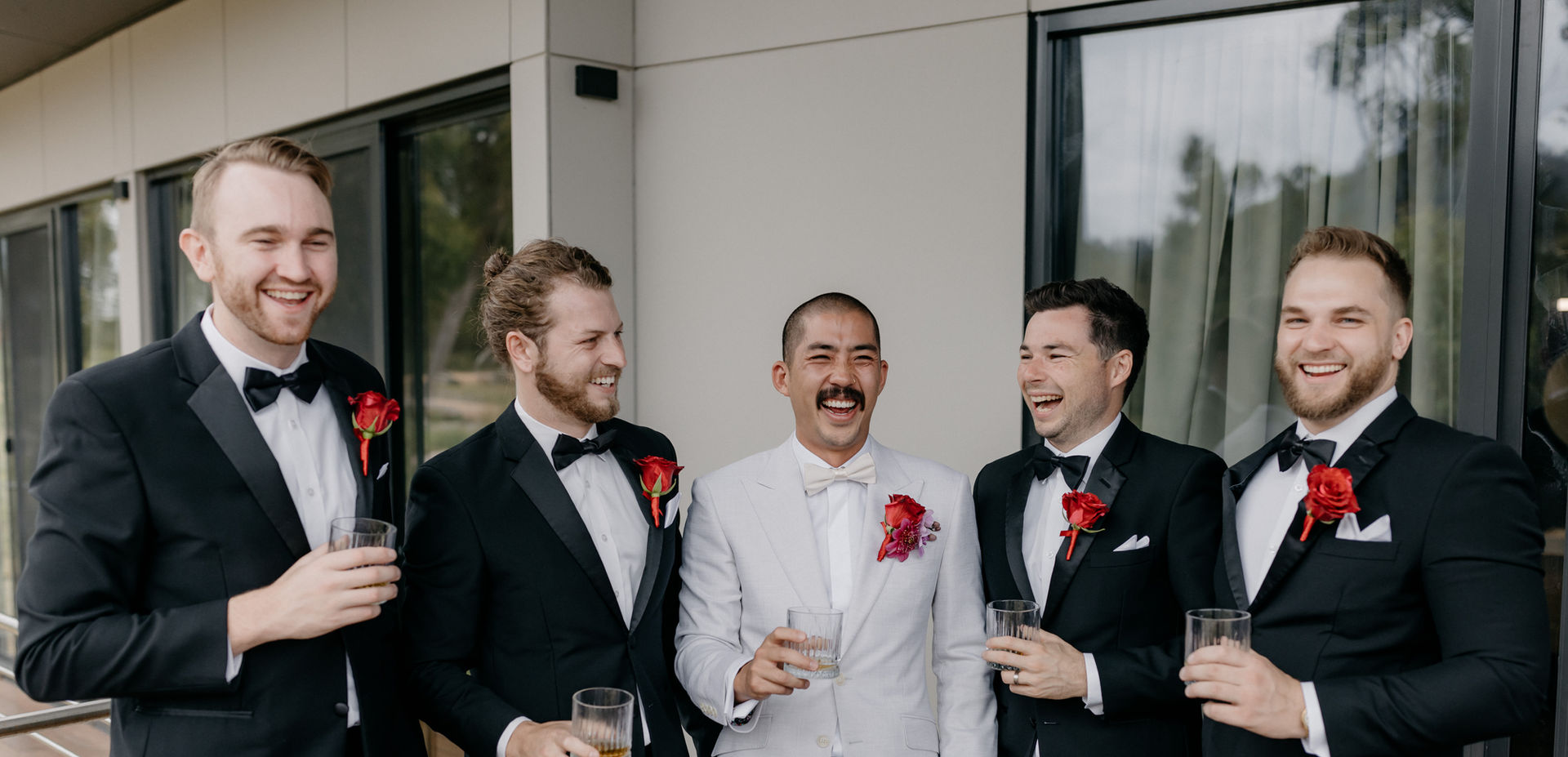 Groom with groomsmen enjoying drinks on deck at KVBR.