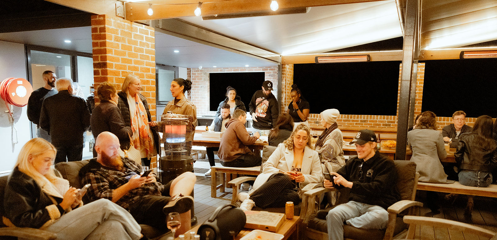 Guests sitting together in guest area outdoor Alfresco Area lounge at KVBR.