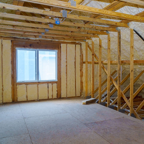 attic-with-foam-insulation-frame-house-in-process-of-in-unfinished-under-construction_edit