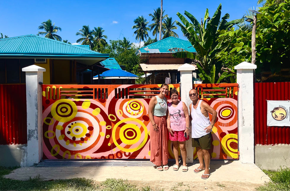 Beautiful colorful mural in the Philippines, Mural artist Hailey Jo Art and Hostel Owners